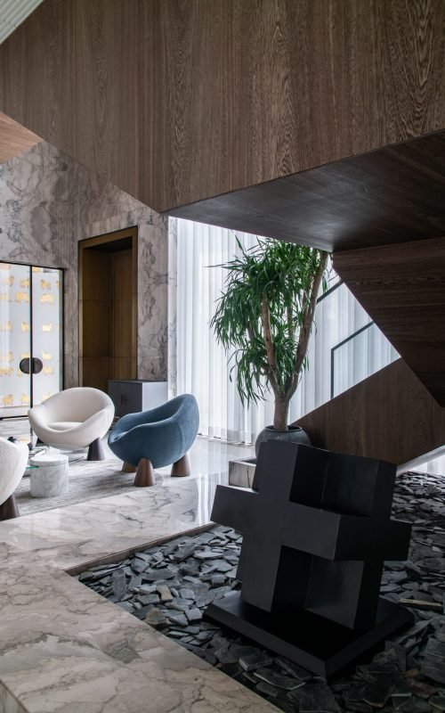 Stylish living space featuring contemporary furniture and marble textures.